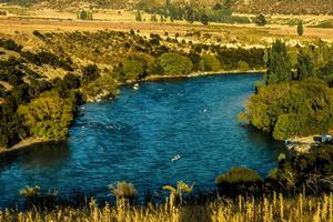 Kayaking teams on Clutha River.